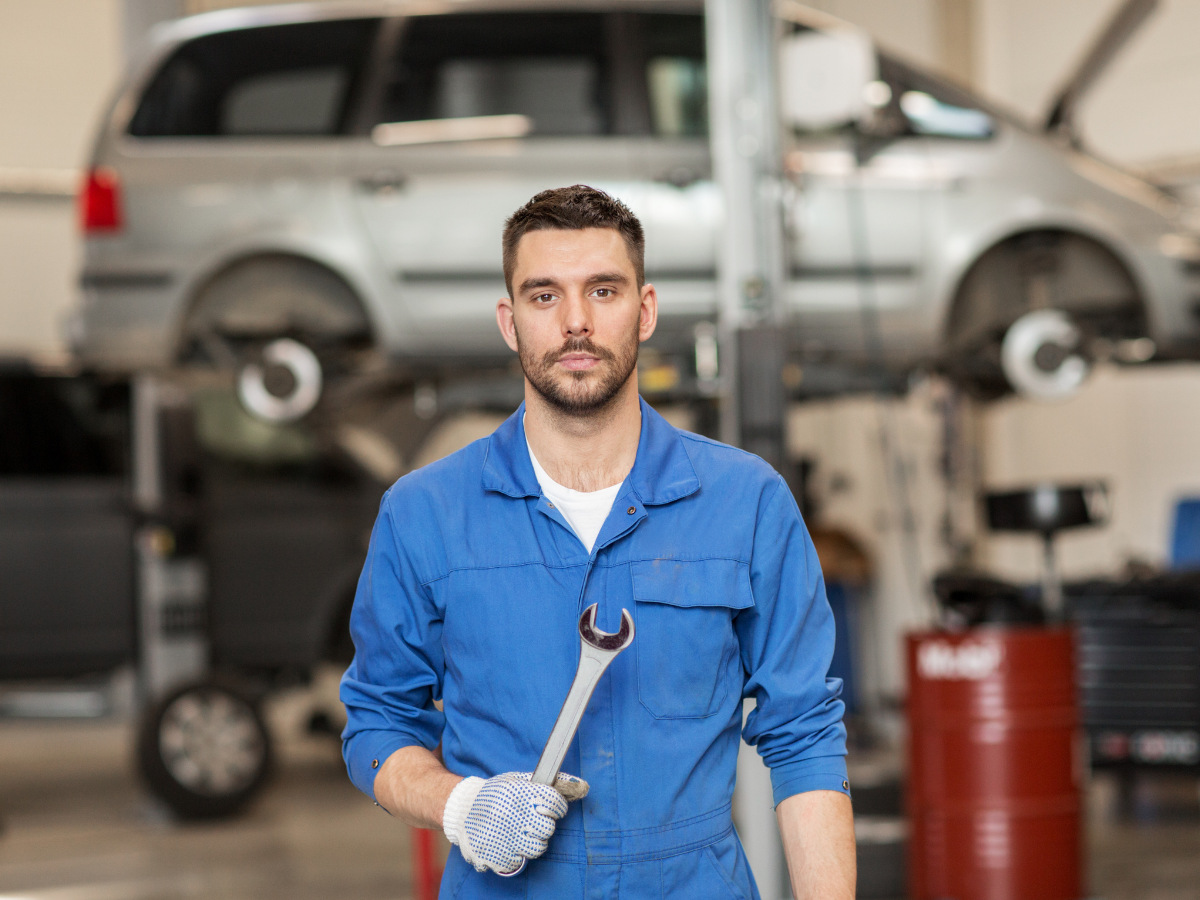 Brothers Auto Care mechanic in the shop holding a wrench